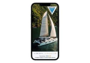 A smartphone mockup displaying a full-screen image of the Vision 444 catamaran sailing in clear green waters near a forested coastline, with the 2024 Cruising World “Boat of the Year” award badge for Best Cruising Catamaran Under 50 Feet featured prominently at the top. The Vision Yachts and TREMATE logos appear along the bottom.